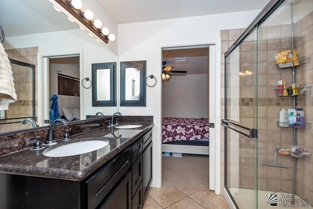 ensuite bathroom featuring ensuite bath, tiled shower, a sink, and tile patterned floors