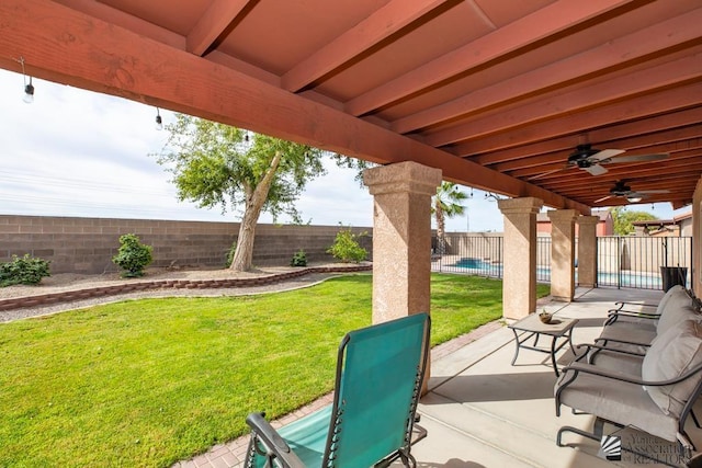 view of patio with a fenced backyard, ceiling fan, and a fenced in pool