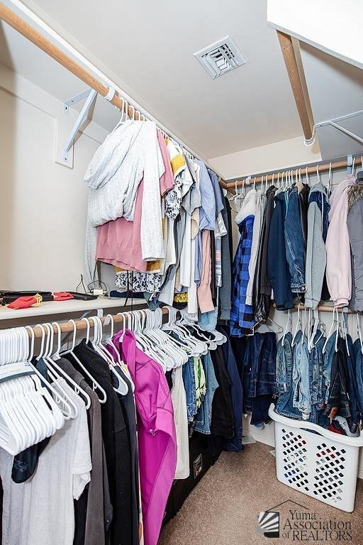 walk in closet with carpet and visible vents