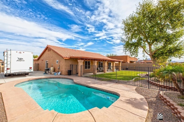 view of swimming pool featuring fence, a fenced in pool, and a patio