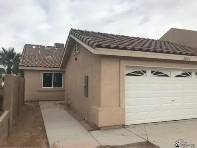 view of side of home with a garage