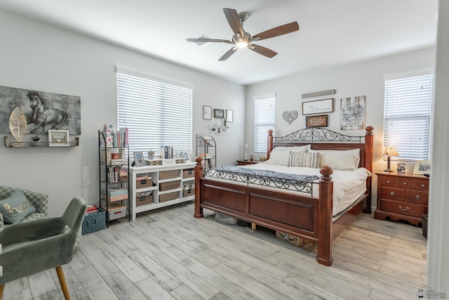 bedroom featuring ceiling fan and light hardwood / wood-style floors