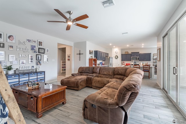 living room with ceiling fan