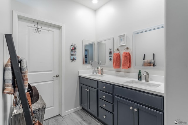 bathroom featuring vanity and hardwood / wood-style floors