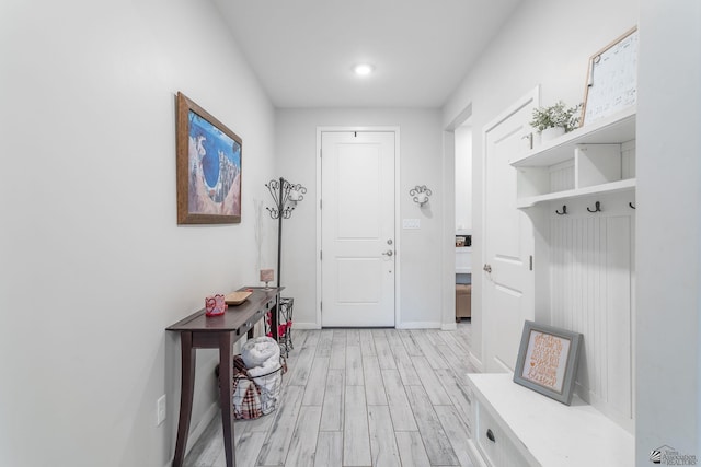 mudroom with light hardwood / wood-style floors