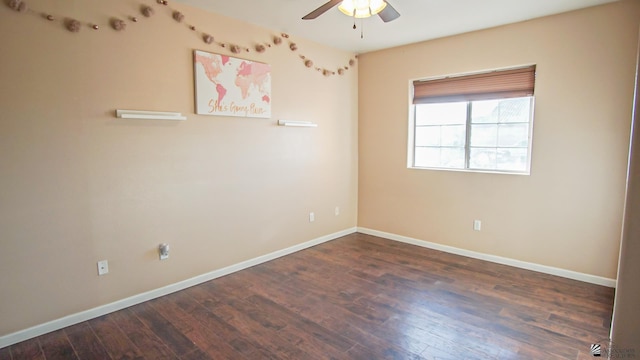 empty room featuring dark hardwood / wood-style floors and ceiling fan