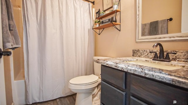 full bathroom with vanity, wood-type flooring, toilet, and shower / bath combo with shower curtain