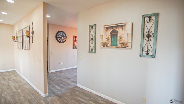 corridor featuring hardwood / wood-style floors