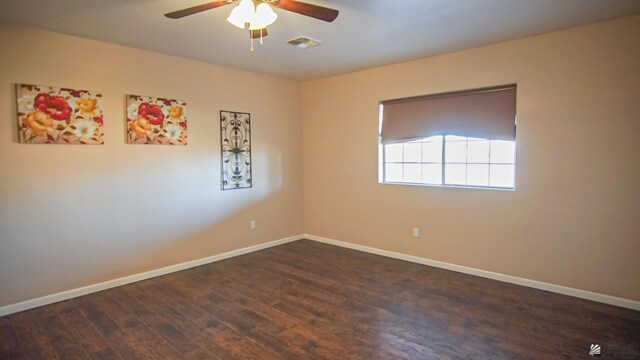 empty room featuring ceiling fan and dark hardwood / wood-style floors