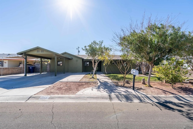 ranch-style house with a carport