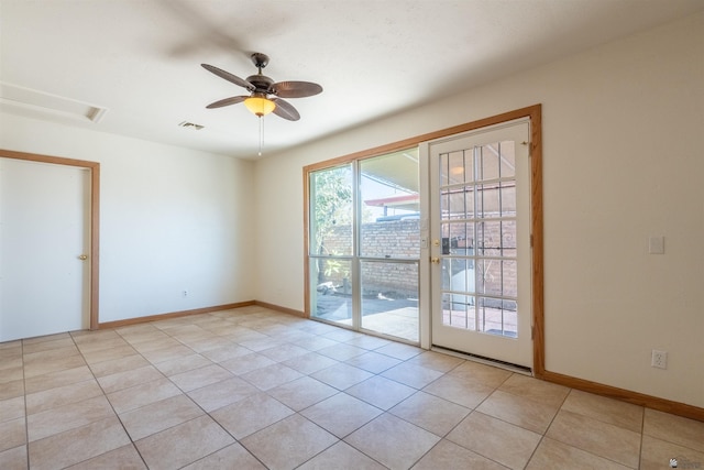 spare room with light tile patterned floors and ceiling fan