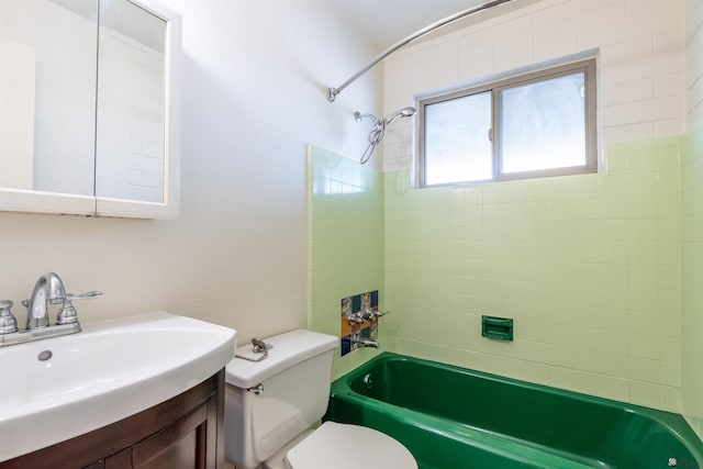 full bathroom with vanity, tiled shower / bath combo, and toilet