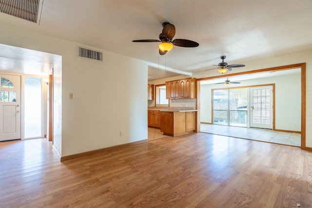 unfurnished living room featuring light hardwood / wood-style floors