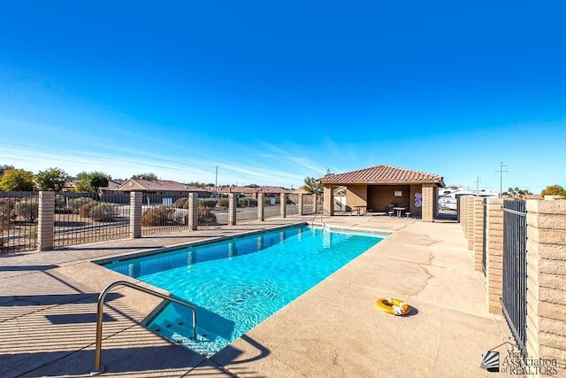 view of swimming pool featuring a gazebo and a patio