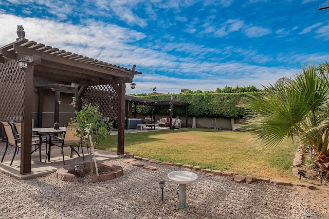 view of yard with a patio area and a pergola