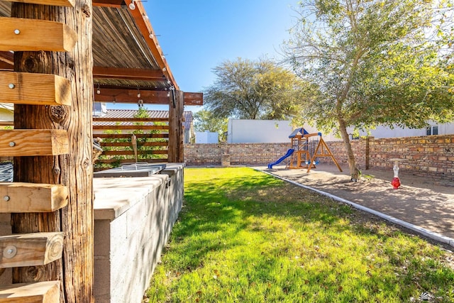 view of yard featuring a playground and fence