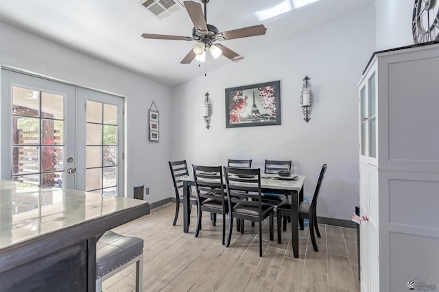 dining area with baseboards, visible vents, french doors, ceiling fan, and wood finish floors