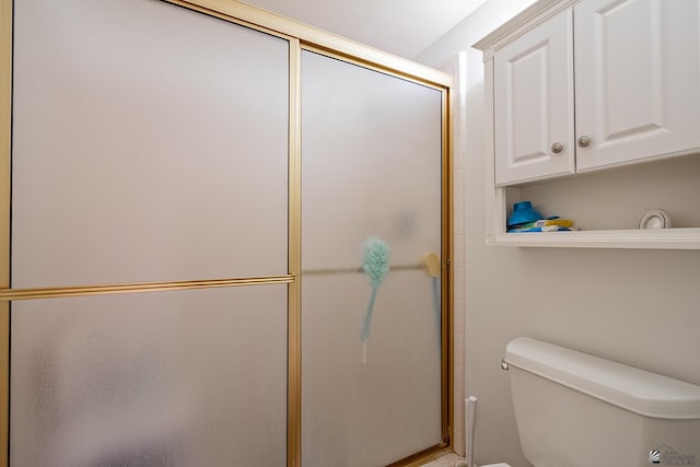 full bathroom featuring an enclosed shower and toilet