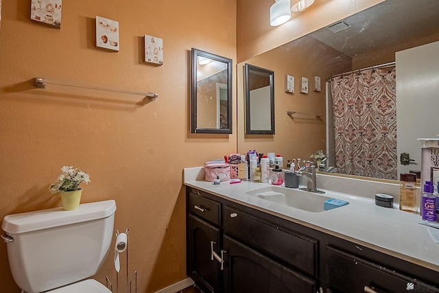 full bathroom with visible vents, toilet, vanity, and a shower with shower curtain