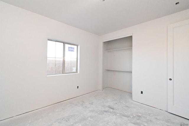 unfurnished bedroom with a closet