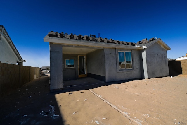 rear view of property with a patio