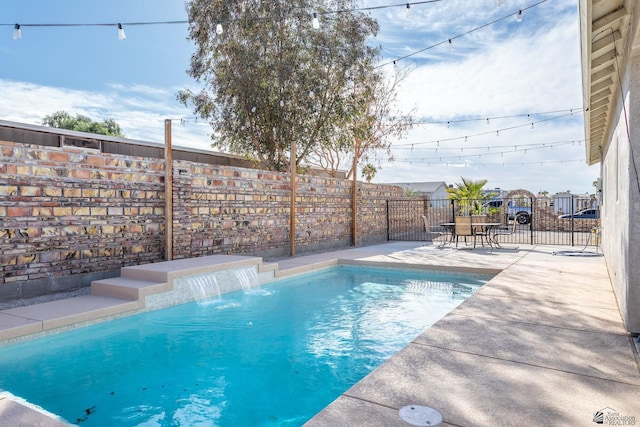 view of pool featuring a patio area