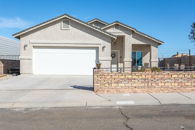 ranch-style house featuring a garage