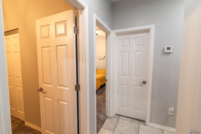 hallway with light tile patterned floors