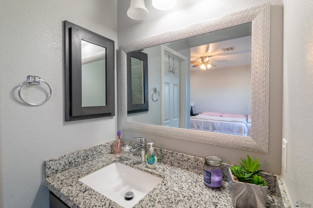 bathroom with vanity and ceiling fan