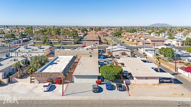 birds eye view of property featuring a mountain view