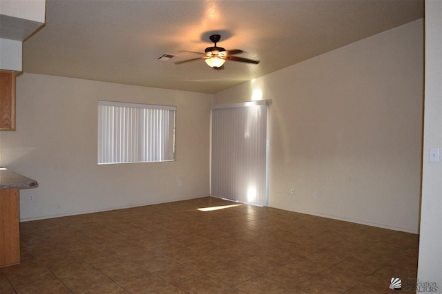 interior space with ceiling fan