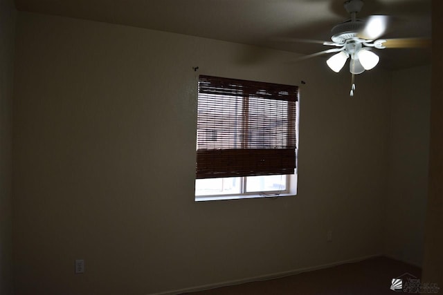 spare room with ceiling fan