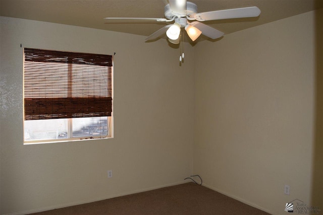 carpeted empty room featuring ceiling fan