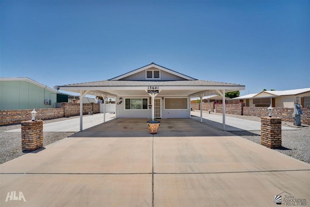 view of front of home featuring a carport