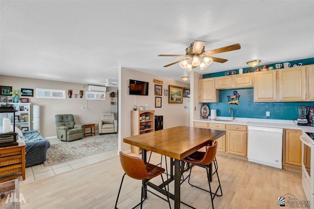 kitchen featuring sink, ceiling fan, light brown cabinets, white appliances, and light hardwood / wood-style flooring