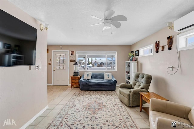 tiled living room with ceiling fan, a textured ceiling, and an AC wall unit