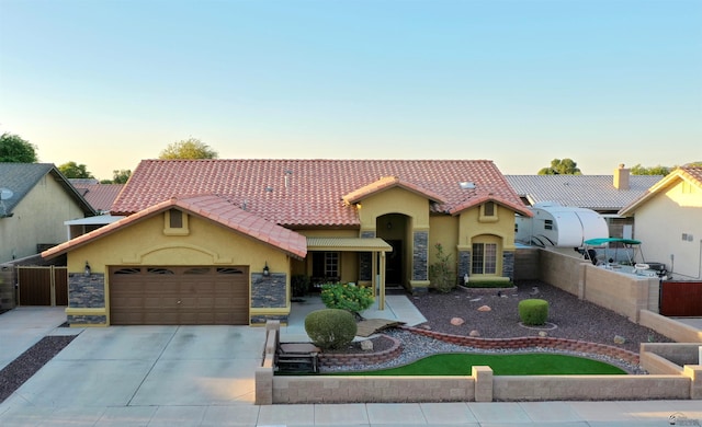 mediterranean / spanish-style home featuring a garage