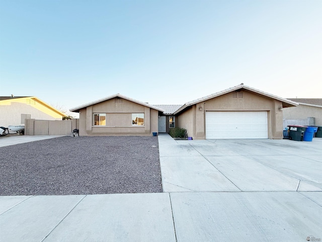 single story home featuring a garage