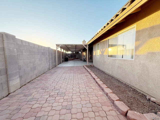 view of patio terrace at dusk