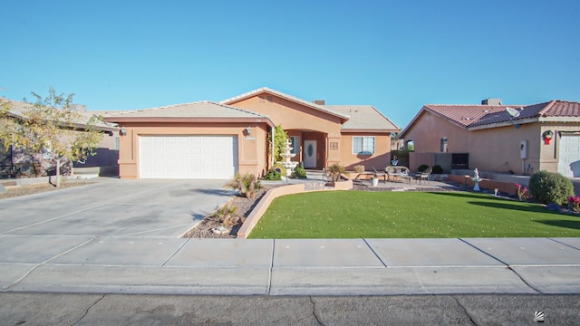 view of front of property with an attached garage, a front lawn, a tiled roof, stucco siding, and driveway