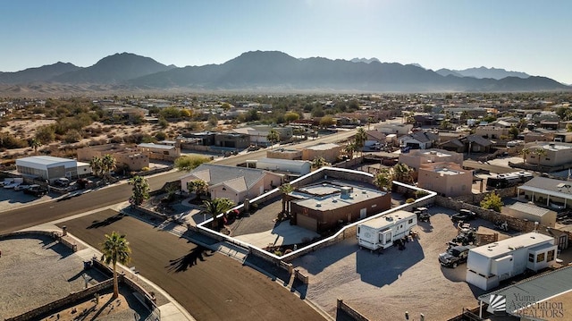 birds eye view of property featuring a mountain view