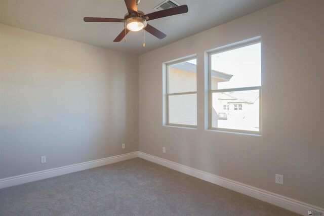 spare room with ceiling fan and carpet flooring