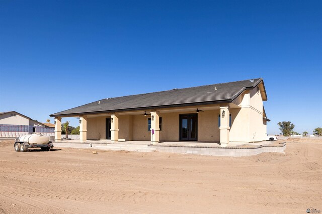 exterior space featuring ceiling fan