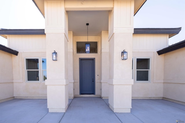 doorway to property featuring a patio area