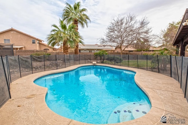 view of pool with a fenced in pool and fence