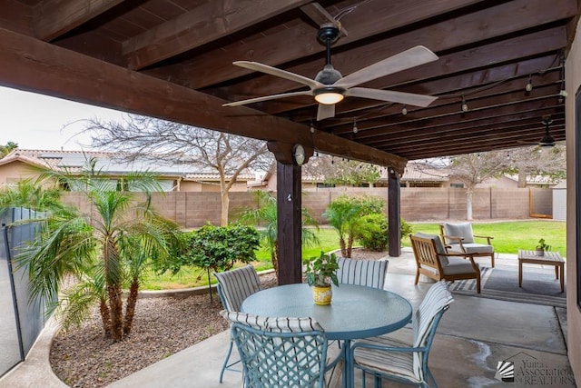 view of patio / terrace with an outdoor living space, a fenced backyard, a ceiling fan, and outdoor dining space