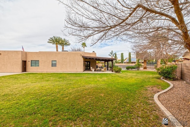 view of yard with a fenced backyard and a patio