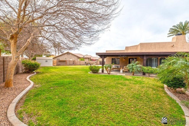 view of yard featuring a patio area and a fenced backyard