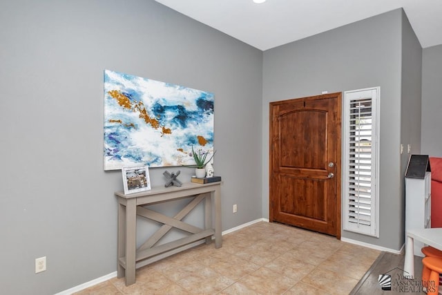 entryway featuring baseboards