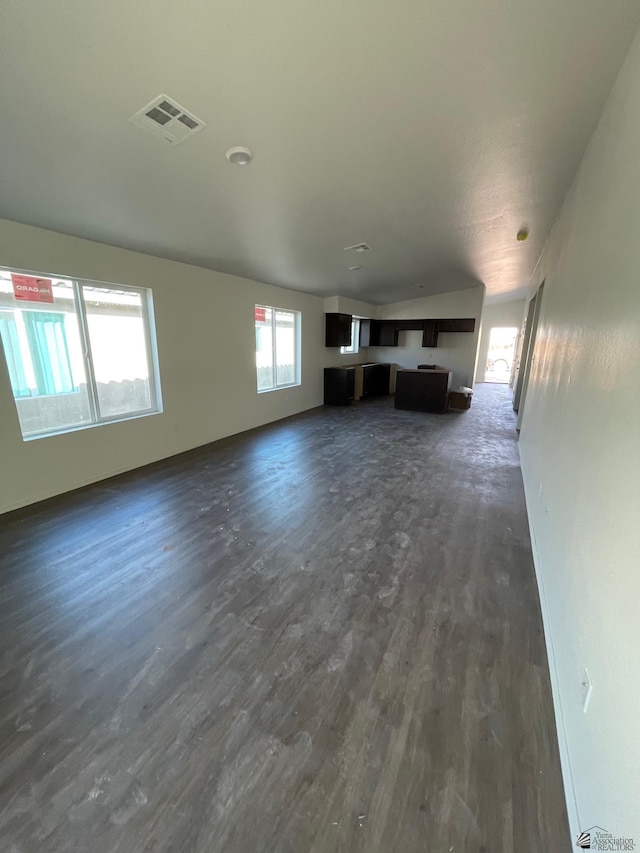 unfurnished living room featuring dark hardwood / wood-style flooring